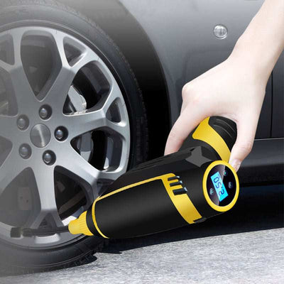 Automatische draagbare luchtcompressor in gebruik om autoband op te pompen met digitale display