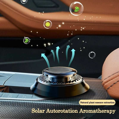 Portable kinetic car air freshener on car dashboard with natural plant essence and solar autorotation aromatherapy